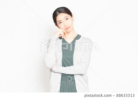 Housewife posing in front of a white background 88633313