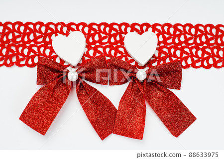 Two white hearts on a red background. Two white hearts on a red background. 88633975