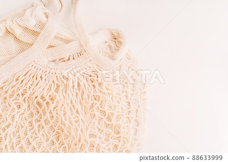 Eco Bags.A variety of eco bags on a yellow background . Sustainable lifestyle.Zero waste minimal composition with tring and canvas bags for storage.Zero waste, eco friendly shopping.Top view,flat lay. 88633999