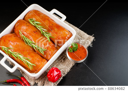 Marinated chicken fillet in red sauce in a casserole dish. Copy space. Fast cooking. Semifinished. Marinated chicken fillet in red sauce in a casserole dish. Copy space. Fast cooking. Semifinished. 88634082
