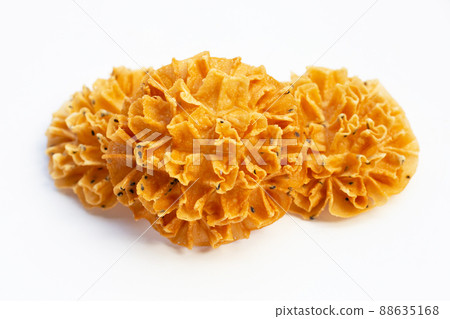 Crispy lotus blossom cookie in white background. Crispy lotus blossom cookie in white background. 88635168