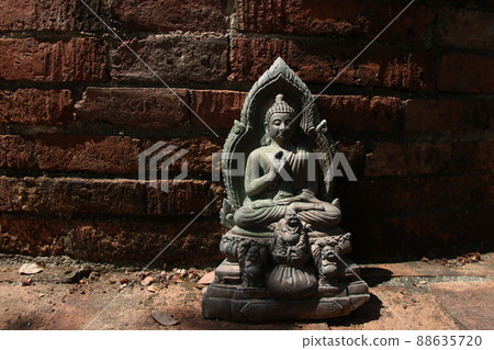 A Buddha statue and retro bricks wall, Thailand. 88635720