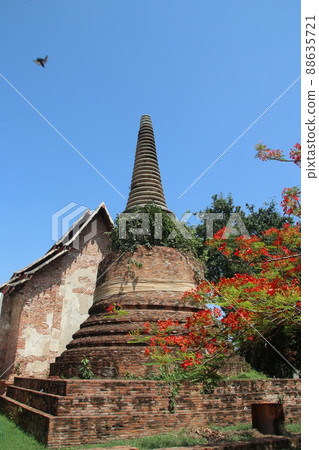 Ancient stupa and church made from red brick and light blue sky. 88635721