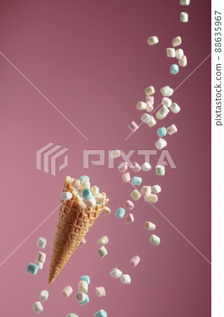 Marshmallows in a waffle cone. 88635967