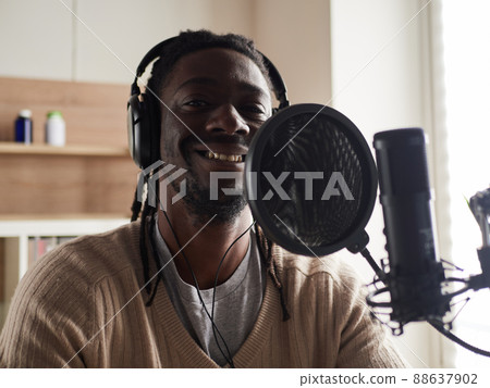 afroamerican male recording audio blog in headphones afroamerican male recording audio blog in headphones 88637902