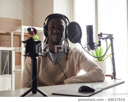 afroamerican male recording audio blog in headphones afroamerican male recording audio blog in headphones 88637918