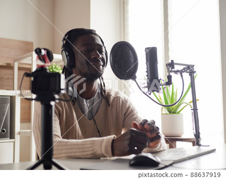 afroamerican male recording audio blog in headphones afroamerican male recording audio blog in headphones 88637919