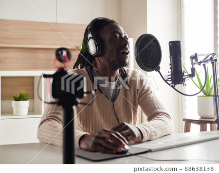 afroamerican male recording audio blog in headphones afroamerican male recording audio blog in headphones 88638138