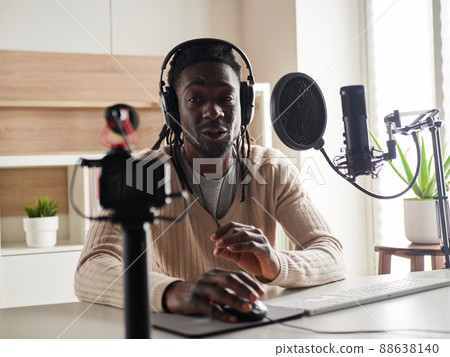 afroamerican male recording audio blog in headphones afroamerican male recording audio blog in headphones 88638140