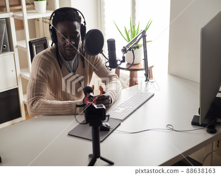 afroamerican male recording audio blog in headphones afroamerican male recording audio blog in headphones 88638163