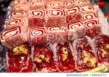 Oriental Sweets. Traditional Turkish Delight (Rahat Lokum) Close-up. Turkish Delight with walnuts and coconut shavings. Top view. 88638774