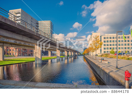Canal with water on orestad boulevard in the city area orestad. On the bridge, metro subway line M1. Copenhagen , Denmark Canal with water on orestad boulevard in the city area orestad. On the bridge, metro subway line M1. Copenhagen , Denmark 88644178