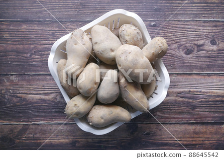 top view of raw potato in a bowl  88645542