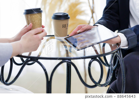 Two women at hand of a business woman who has a business talk Two women at hand of a business woman who has a business talk 88645643