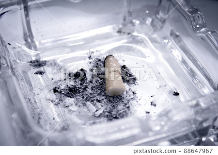 Cigarette consumed in an ashtray with ashes Cigarette consumed in an ashtray with ashes 88647967