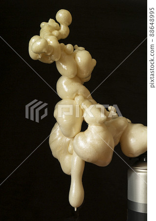 construction foam on dark background close-up. 88648995