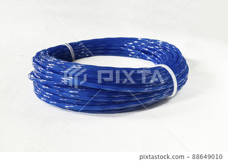Blue spool for trimmer insulated on white background Blue spool for trimmer insulated on white background 88649010