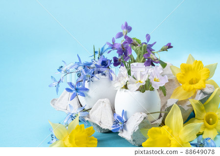 Floral Easter arrangement on a blue background. packaging for eggs and Floral Easter arrangement on a blue background. packaging for eggs and 88649078
