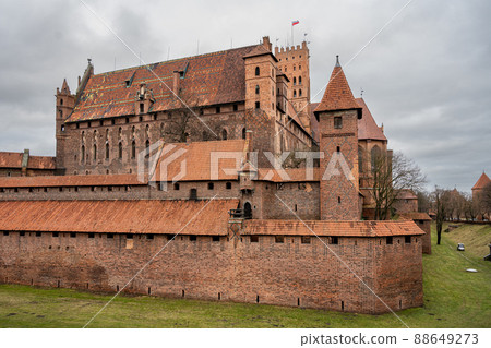 The Castle of the Teutonic Order in Malbork in the Pomerania region, Poland. This is the largest castle in the world measured by land area and a UNESCO World Heritage Site The Castle of the Teutonic Order in Malbork in the Pomerania region, Poland. This is the largest castle in the world measured by land area and a UNESCO World Heritage Site 88649273