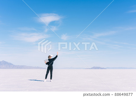 Unrecognizable woman in headset against cloudy sky 88649877