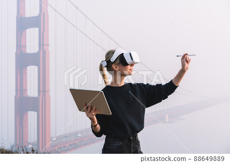 Unrecognizable woman in VR headset Unrecognizable woman in VR headset 88649889