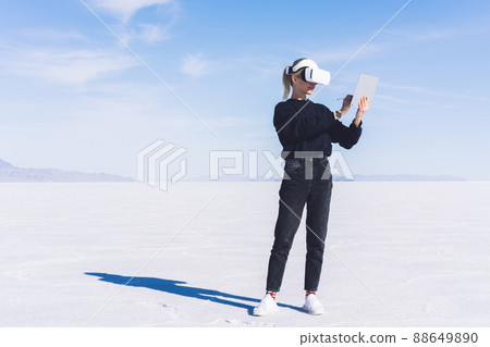 Serious lady writing on graphics tablet Serious lady writing on graphics tablet 88649890