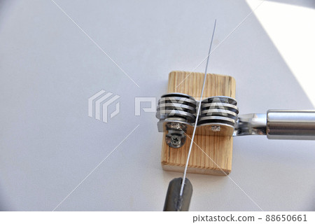 Sharpening an iron knife with a sharpener Sharpening an iron knife with a sharpener 88650661