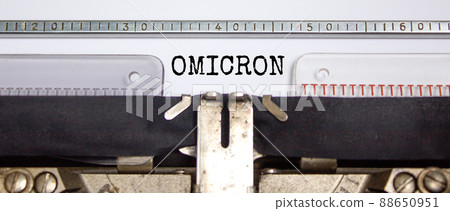Covid-19 corona and omicron symbol. The concept word Omicron typed on retro typewriter. Beautiful white background. Medical covid-19 corona omicron concept. Copy space. 88650951