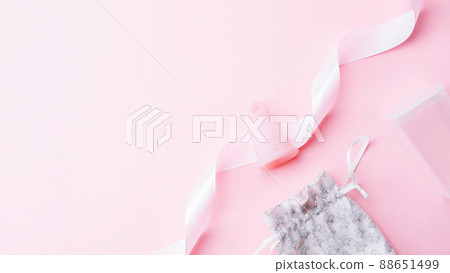 Menstrual cycle sanitary cup. Pink ribbon with menstrual cup. Menstruation feminine period. Sanitary hygiene banner. Use menstrual cup inside vagina. Menstrual cycle sanitary cup. Pink ribbon with menstrual cup. Menstruation feminine period. Sanitary hygiene banner. Use menstrual cup inside vagina. 88651499