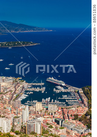 Aerial view of port Hercules of Monaco at sunset, Monte-Carlo, huge cruise ship is moored in marina, view of city life from La Turbie mountain, a lot of mega yachts and boats 88651836