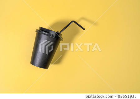 Coffee cup fly on yellow background. Coffee container mock up, blank space for logo. 88651933