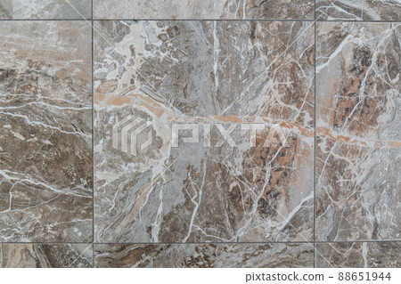 Tile on the floor is brown with a pattern of background texture. Granite tile stone ceramic tile. Tile on the floor is brown with a pattern of background texture. Granite tile stone ceramic tile. 88651944