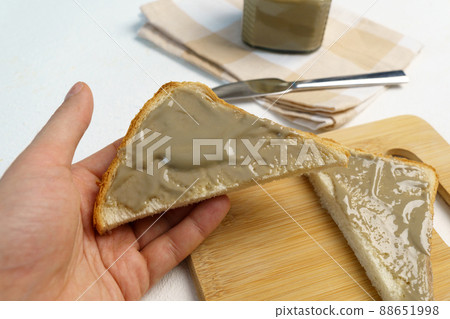 Organic sunflower seed butter. Alternative to butter. Food trend. Selective focus Organic sunflower seed butter. Alternative to butter. Food trend. Selective focus 88651998