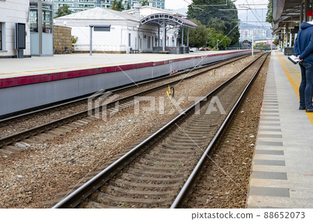 Railroad tracks at the platform at the station. Railroad tracks at the platform at the station. 88652073