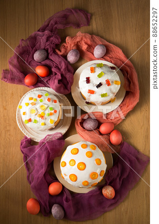 Easter cakes with jelly sweets and kumquat, top view Easter cakes with jelly sweets and kumquat, top view 88652297