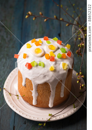 Easter cakes decorated with Jelly candy in the shape of an egg on a wooden background 88652322
