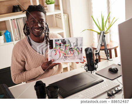 Graphic designer/photographer working in home office Graphic designer/photographer working in home office 88652487
