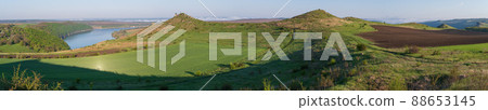 Amazing spring view on the Dnister River Canyon with picturesque rocks, fields, flowers. This place named Shyshkovi Gorby, Nahoriany, Chernivtsi region, Ukraine. Amazing spring view on the Dnister River Canyon with picturesque rocks, fields, flowers. This place named Shyshkovi Gorby, Nahoriany, Chernivtsi region, Ukraine. 88653145