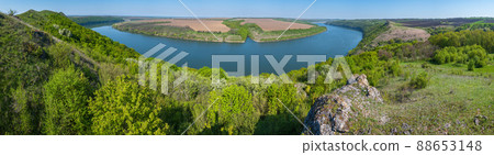 Amazing spring view on the Dnister River Canyon with picturesque rocks, fields, flowers. This place named Shyshkovi Gorby, Nahoriany, Chernivtsi region, Ukraine. Amazing spring view on the Dnister River Canyon with picturesque rocks, fields, flowers. This place named Shyshkovi Gorby, Nahoriany, Chernivtsi region, Ukraine. 88653148