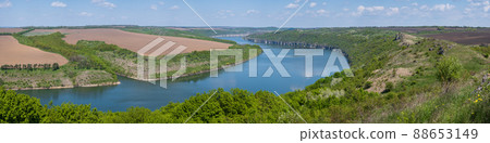 Amazing spring view on the Dnister River Canyon with picturesque rocks, fields, flowers. This place named Shyshkovi Gorby, Nahoriany, Chernivtsi region, Ukraine. Amazing spring view on the Dnister River Canyon with picturesque rocks, fields, flowers. This place named Shyshkovi Gorby, Nahoriany, Chernivtsi region, Ukraine. 88653149