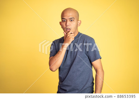 shocked asian bald man with hands holding mouth shocked asian bald man with hands holding mouth 88653395