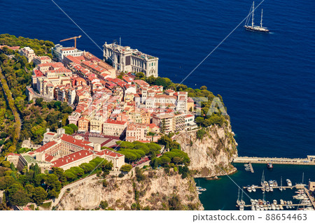 Aerial view of port Fontvieille at sunset, Oceanographic Museum of Monaco, South France, a lot of boats are moored in marina, view of city life from La Turbie mountain, mega yachts, luxury apartments Aerial view of port Fontvieille at sunset, Oceanographic Museum of Monaco, South France, a lot of boats are moored in marina, view of city life from La Turbie mountain, mega yachts, luxury apartments 88654463