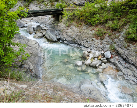 A bridge and a river on the way to Kawarage Oyutaki (Yuzawa City, Akita Prefecture) 88654875