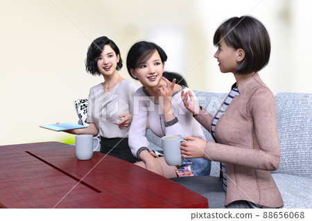 Three female employees sit on a white sofa in front of a reddish wooden desk and have a fun conversation during a break. 88656068
