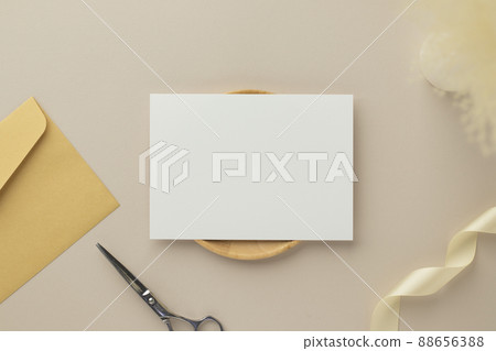 Blank greeting card invitation Mockup 5x7 on envelope with dry flowers and ribbon on paper background, flat lay, mockup Blank greeting card invitation Mockup 5x7 on envelope with dry flowers and ribbon on paper background, flat lay, mockup 88656388