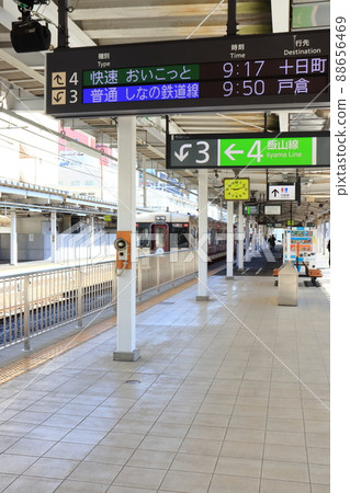 The first train from Nagano Station Oykot and the electric bulletin board 88656469