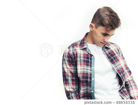 young handsome teenage hipster guy posing emotional, happy smiling against white background isolated, lifestyle people concept 88658338