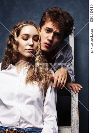 young pretty boy and girl friends happy smiling together in interior, emotional couple, lifestyle people concept young pretty boy and girl friends happy smiling together in interior, emotional couple, lifestyle people concept 88658419
