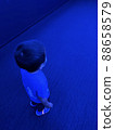 A child 3 years old walking alone in the dim light 88658579