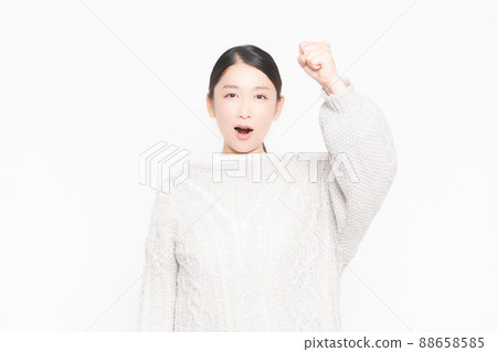 An angry woman with her arms raised 88658585